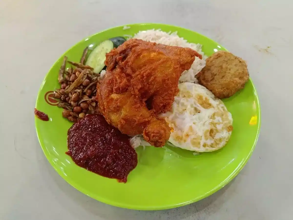 Nasi Lemak 67: Nasi Lemak with Quarter Fried Chicken, Fried Egg, Ikan Bilis Peanuts & Begedil