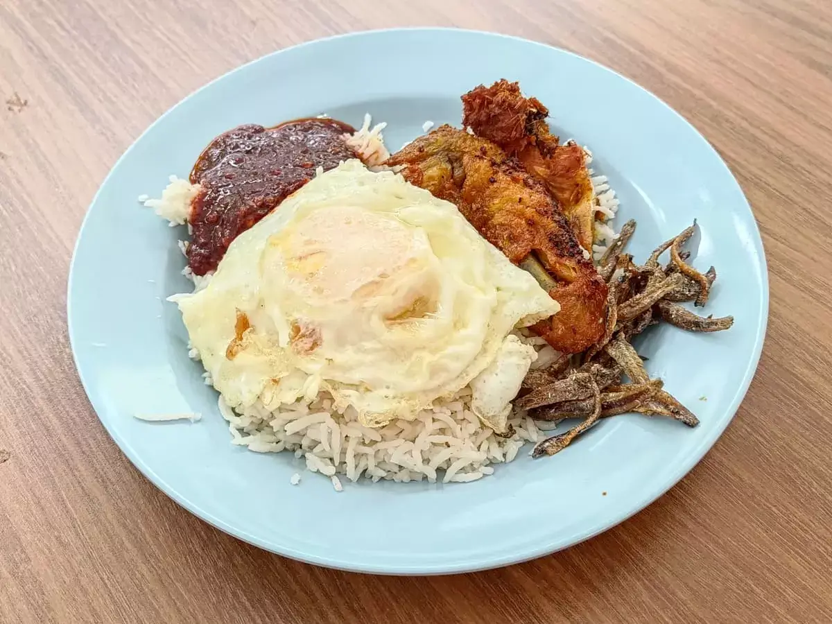 Nasi Lemak Goreng SG: Nasi Lemak with Chicken Wing, Fried Egg, Ikan Bilis Peanuts